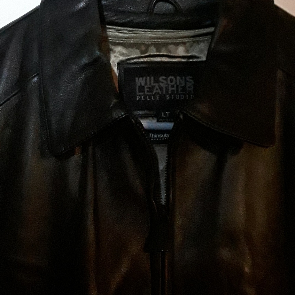 Elegant black leather three quarter length jacket